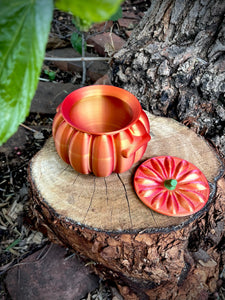 Decorative pumpkin on a wooden stump with leaves in the background